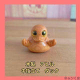 Brand new wooden duck figurine, middle finger up.