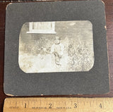 Photo on Board, Child Alec Morrison with a Cap and overalls, ? Leg braces Model