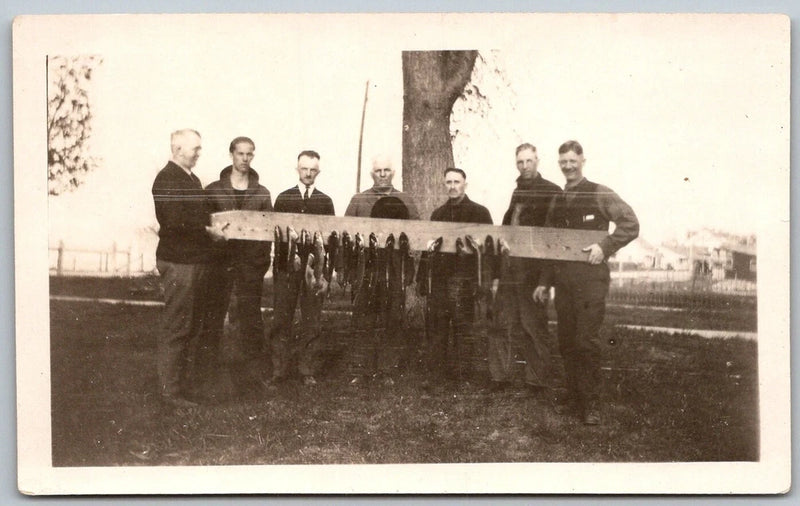 1930s Original Snapshot Photograph Men Holding Board Hanging Fish Fishermen Model