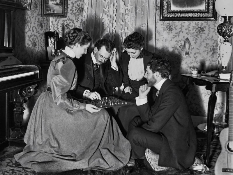ANTIQUE GLASS PLATE NEGATIVE:  COUPLES PLAYING A BOARD GAME IN THE MUSIC ROOM Model