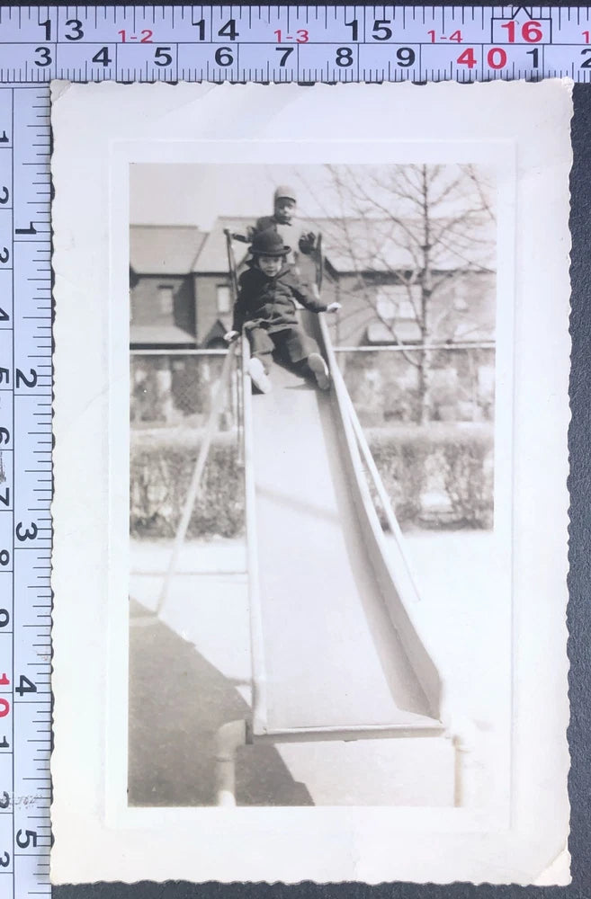Children on Metal Park Sliding Board Leisure Fun Time BW Photo Snapshot Model