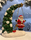 Holiday  Collection Santa In Swing Hanging from Tree Figurine Christmas Village Model