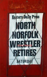 PHOTO  NEWSPAPER ADVERTISING BOARD CROMER WHILE THE WIDER WORLD CONCERNS ITSELF Model