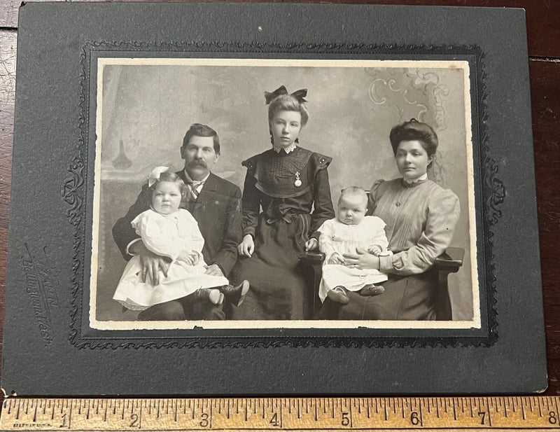 Photo on Board, Family of 5, Oldest Child in Center with Watch Pin and Bow Model