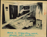 1986 Press Photo Board is supporting wood placed over broken window - lrb30512 Model