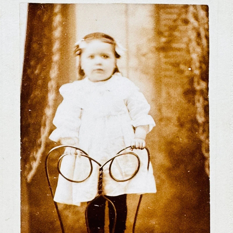 Toddler Girl Child Standing on Metal Chair Prop Stella Gladu Board Mounted Photo Model