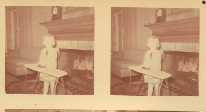 vintage color photo girl ironing board iron clothes by the fireplace Model