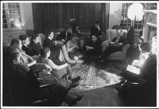Group of people at Bedales Boarding School sit in a circle and lis- Old Photo Model