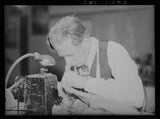 Photo:New York NY 1940s Fur Worker at Sewing Machine War Emergency Board Model