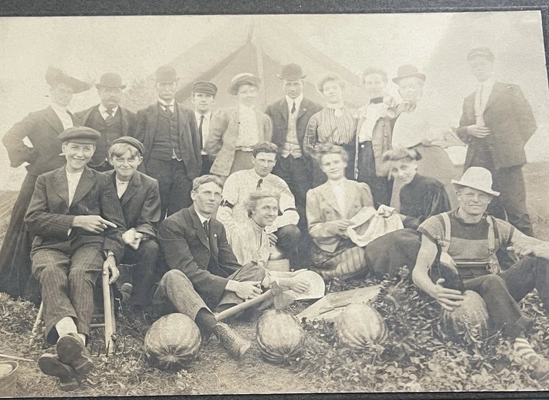 Photo on Board, People in Front of Tent Pumpkins, Hats,Variety of Outfits Model