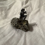 Pyrite Mineral Specimen Display with Decorative Miner Figurine on Natural Rock Model