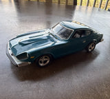 Plastic 1/24 scale model car.  Unsure of the model company. Display??s well. Model