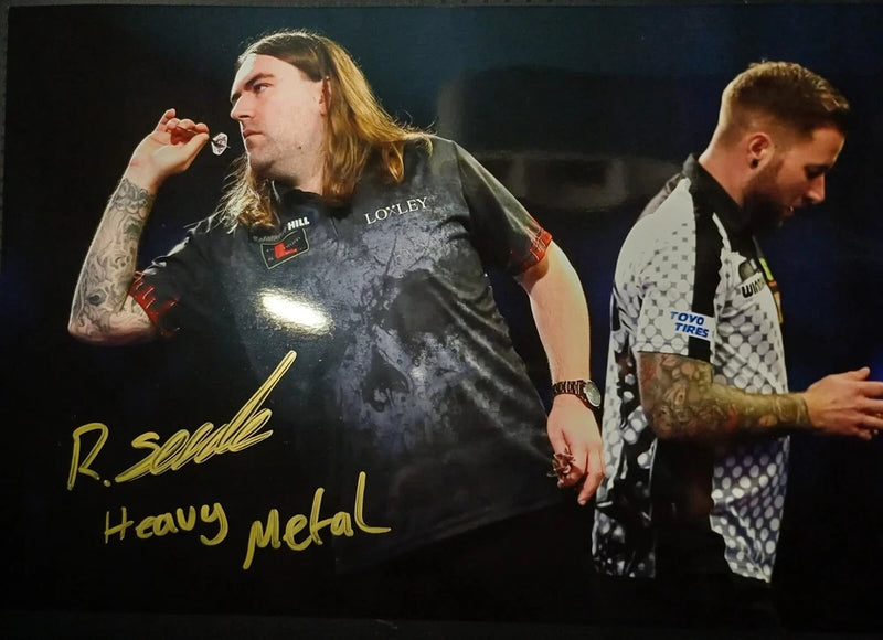 ryan searle about to throw dart at board during his game signed 12x8 photo Model