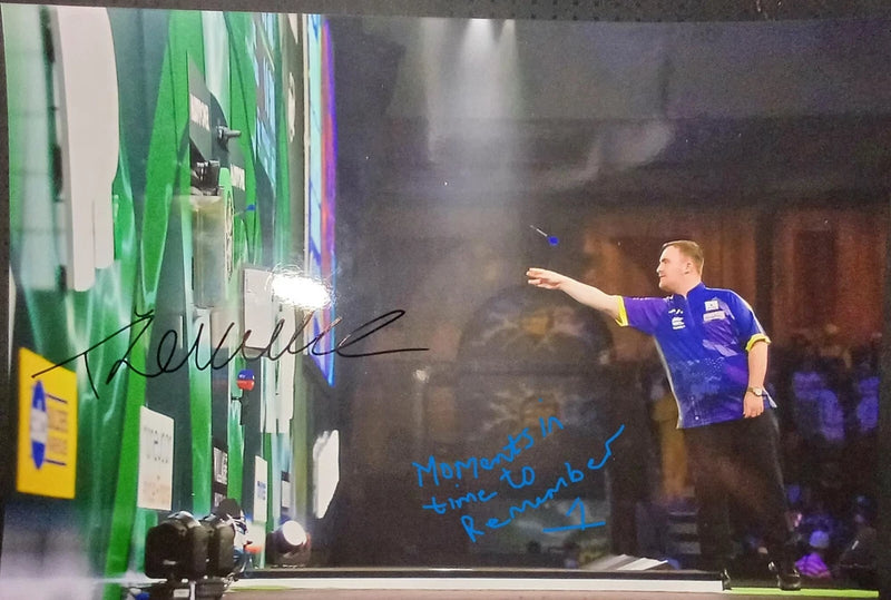 luke littler throws a dart at the board during his match signed 12x8 photo Model