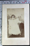 Victorian Board Mounted Antique Photograph - Little Child in White Stands Chair Model