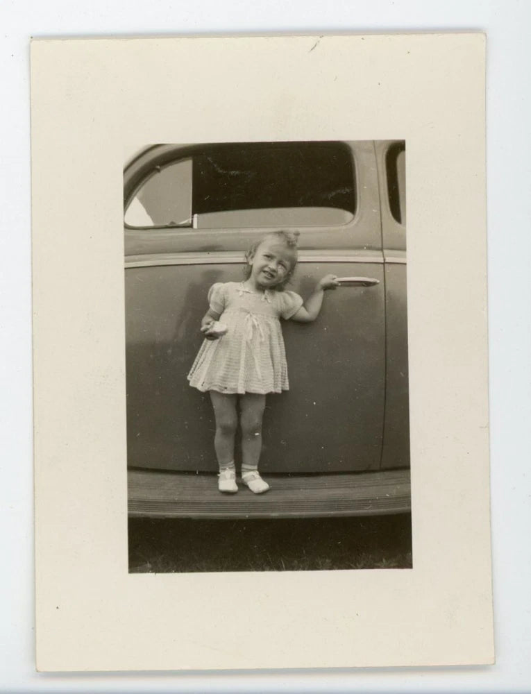 Little girl in dress on running boards of automobile car vintage  photo Model