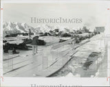 Press Photo Alyeska Pipeline Service workers spreading board panels in Alaska Model