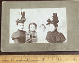 Photo on Board, 2 Females wearing Ornate Hats, and 2 Young Children, 5.25 x 3.5 Model