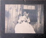 Antique board photo  Woman Reading by the Window in Early 1900s Model