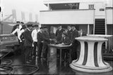 Crew members board Cunard liner RMS Aquitania receiving forms to e- Old Photo Model