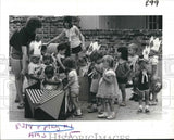 1982 Press Photo Children's Village Preschool Children Board a Toy Train Model