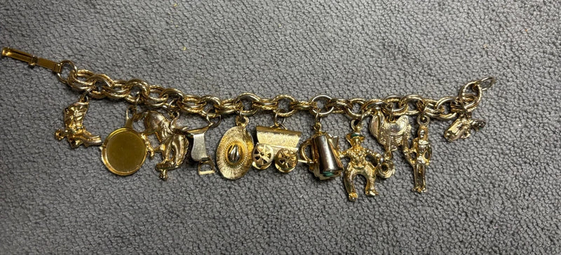 Vintage Gold Tone Charm Bracelet with Western and Travel-Themed Charms Charms