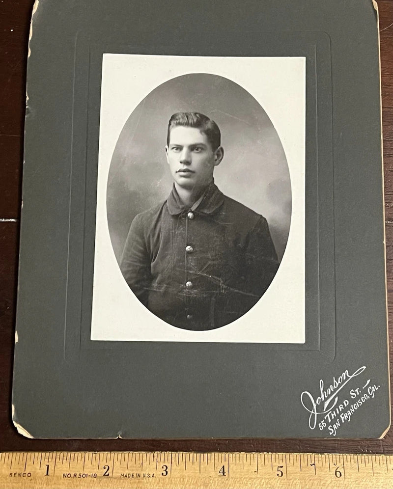 Photo on Board, Young Man wearing a button up coat. by Johnson San Francisco Cal Model
