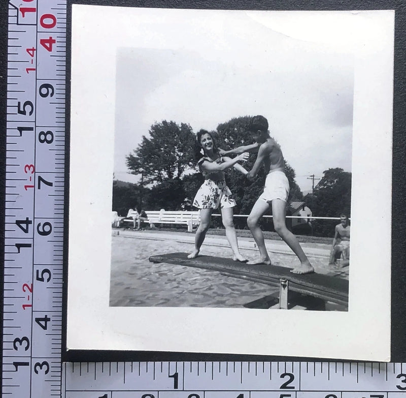 Man and Woman Fighting on Diving Board Swimming Fun Photo Snapshot Model