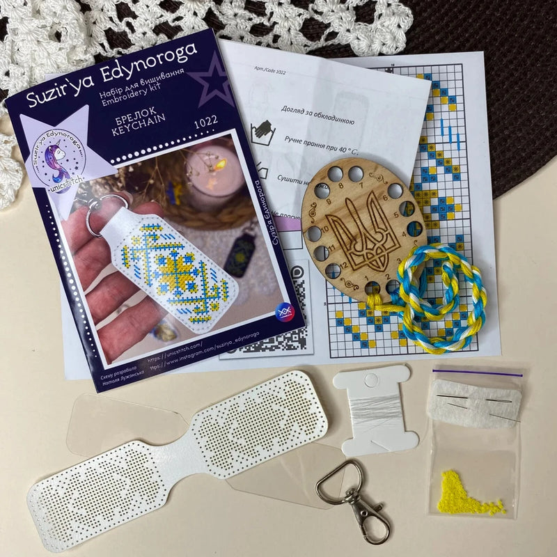 DIY Cross-stitch embroidery kit on faux leather Keychain on white Model