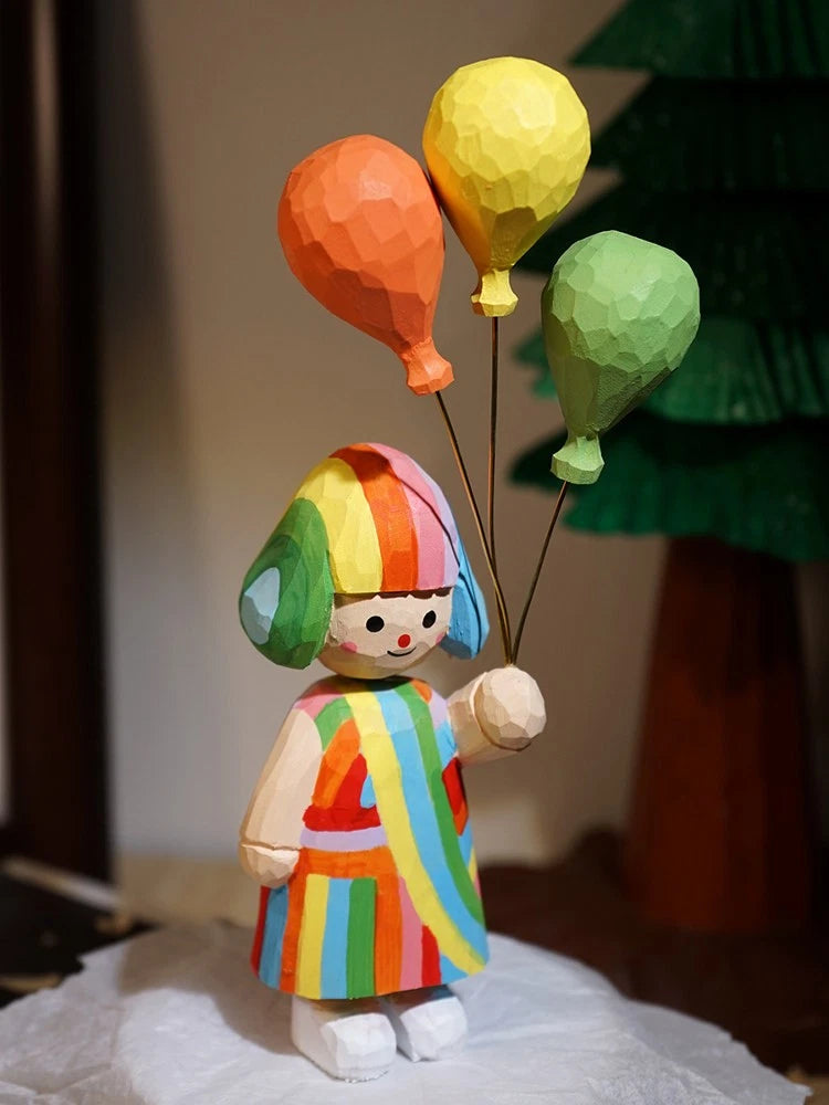 Handmade wooden carving girl holds balloons as a romantic birthday gift Model