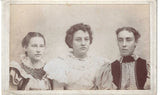 Three Ladies in a 1900's posed photograph affixed to a mounting board Model