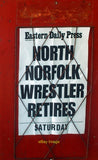 Photo 6x4 Newspaper advertising board Cromer While the wider world concer c2011 Model