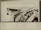1975 Press Photo Volunteers and orphans board Air Force plane at Saigon Air Base Model