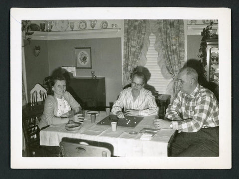 People Playing Aggravation Board Game at Dining Table Snapshot Photo 1960s Model