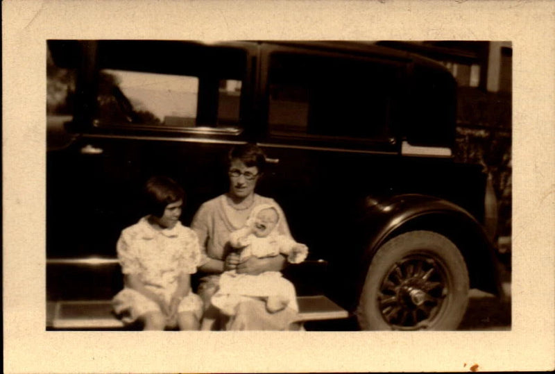 Vintage photograph Woman with Children on Running Boards of Old Car Model